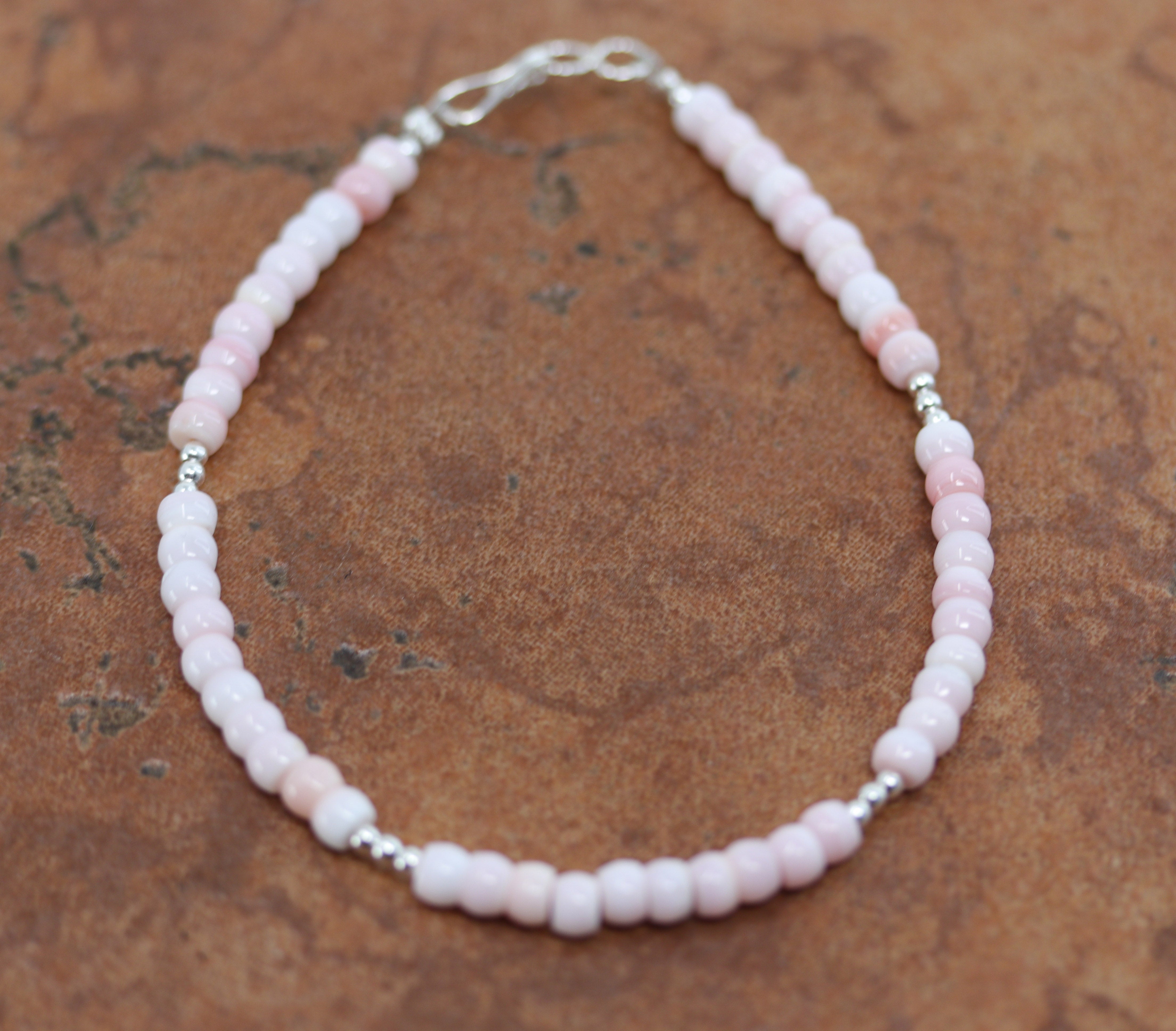 A beautiful Navajo Heishi bracelet. It is about 7 3/4" from end to end and 1/4" wide. 