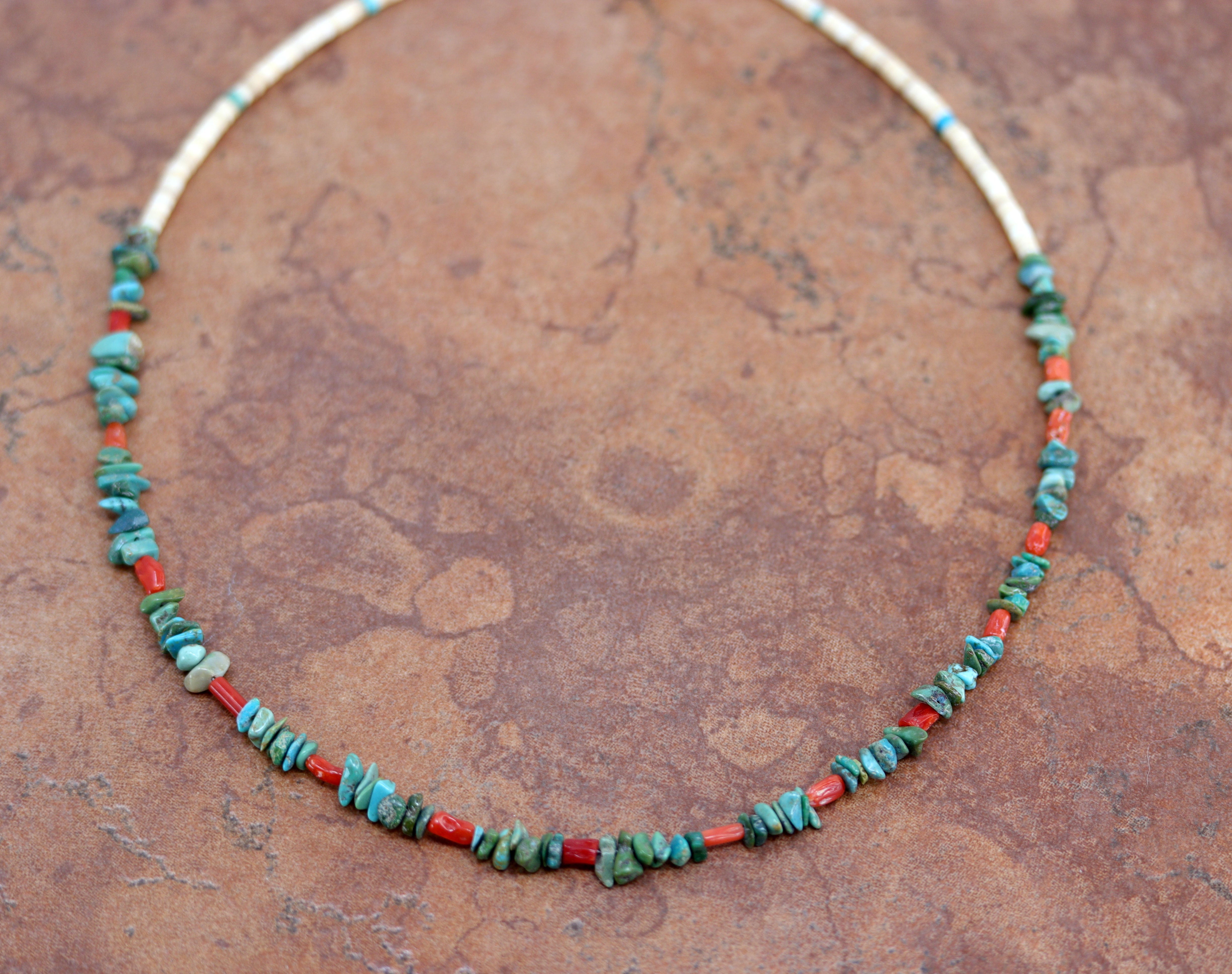 A Beautiful Navajo Native American necklace. The necklace is 18" in length and the larger pebbles measures 3/8".