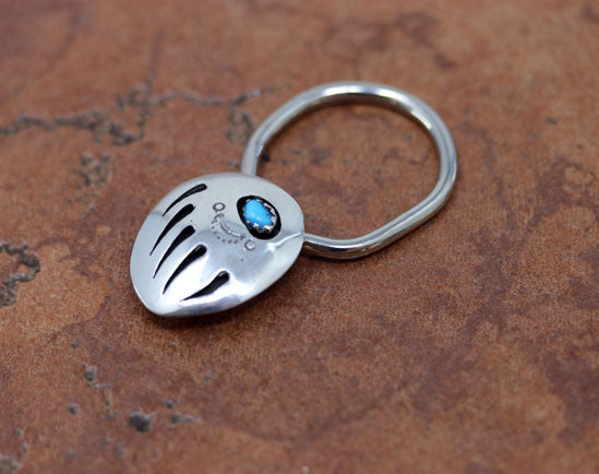 A very nice Navajo Native American key chain by Ervin Begay. It is made from sterling silver and turquoise. The key chain is about 1 7/8" in length and 3/4".