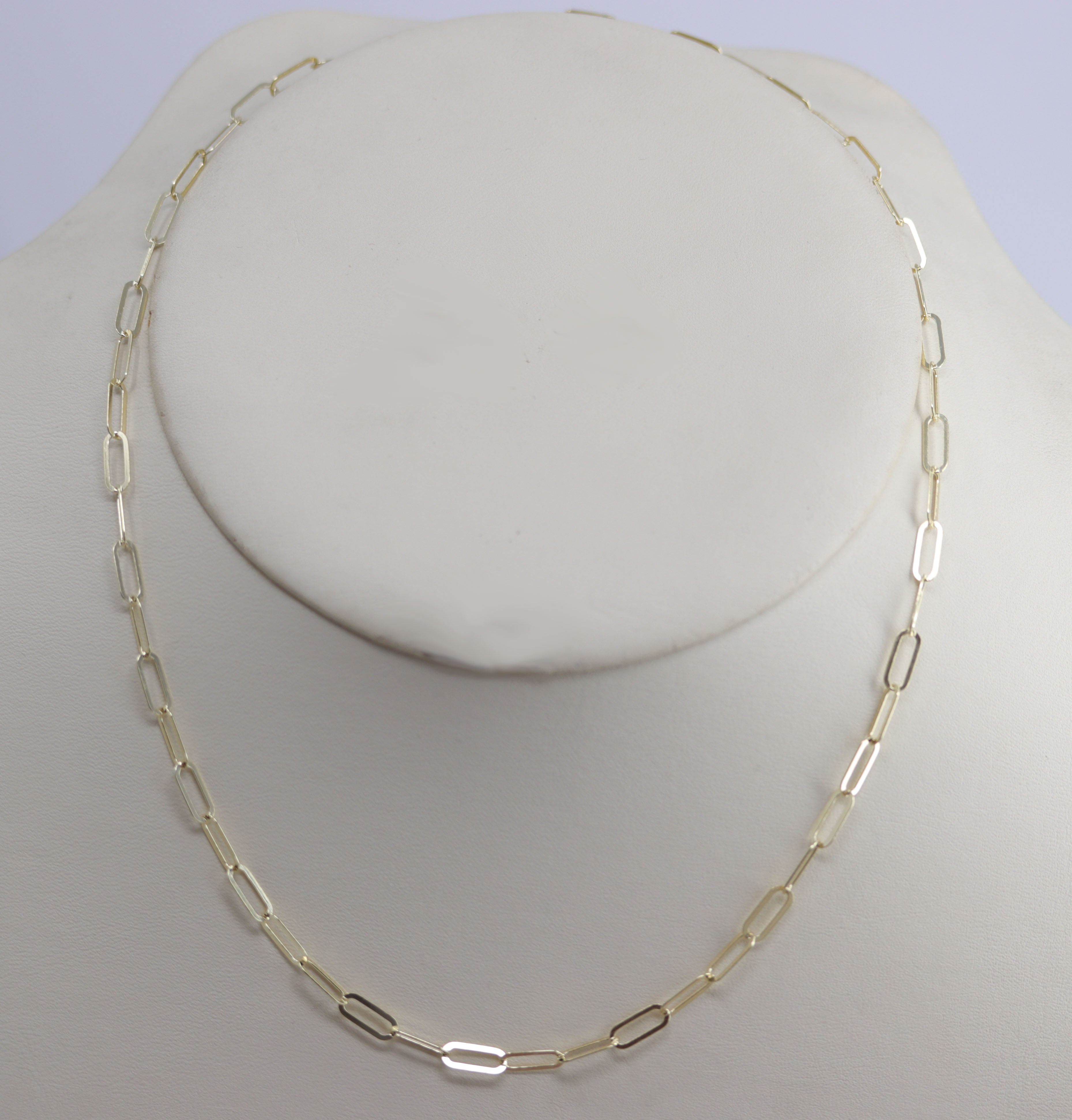 A Beautiful Paper Clip Chain Link Necklace. It is made from .925 sterling silver and gold overlay. The length is about 18" and the width is 3/16". 