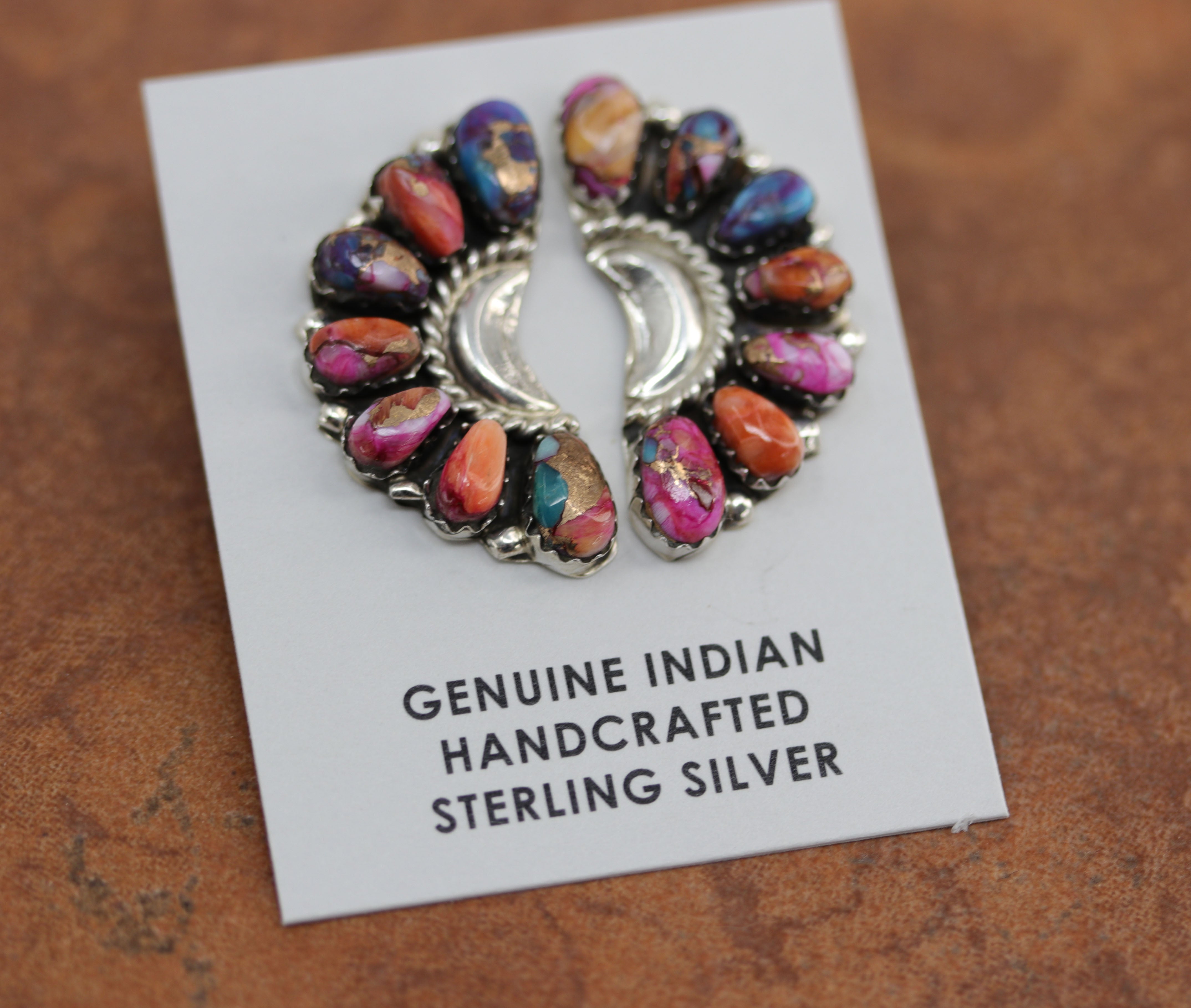 Authentic beautiful Navajo Native American cluster earrings. They are made from sterling silver and mojave turquoise. The earrings are about 1 1/4" in length and 5/8" in width.&nbsp;