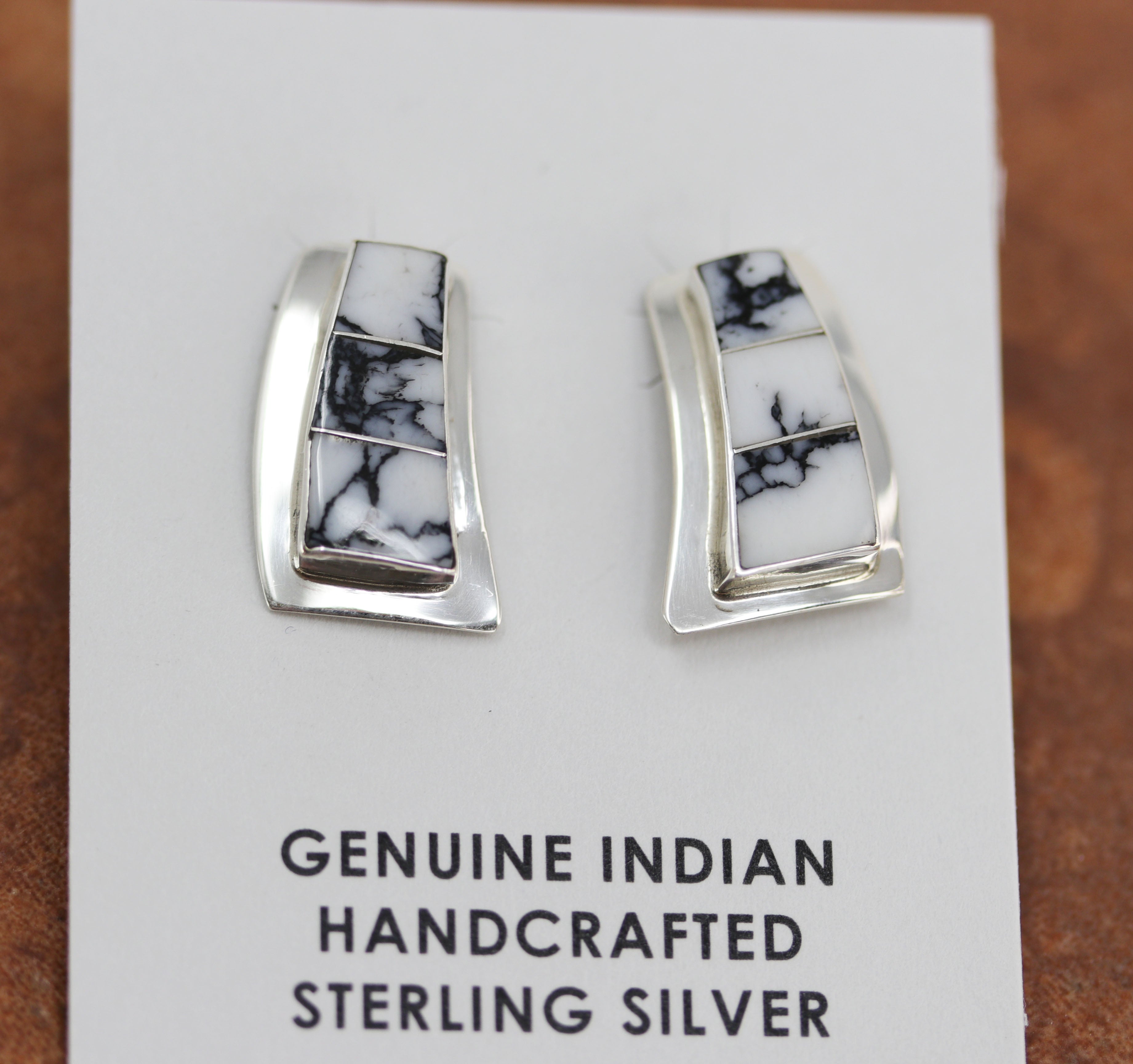 Beautiful earrings made from sterling silver and howlite. Each earring measures about 7/8" in length and 1/2" in width.
